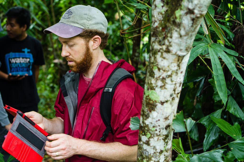 Rainforest Alliance Chief Scientist Jeffrey Milder collects data on a cocoa farm in Indonesia.