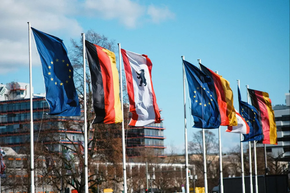 Row of flags including the EU and other countries.