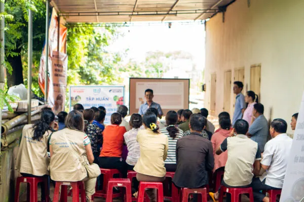 Speaker leading a workshop in Vietnam
