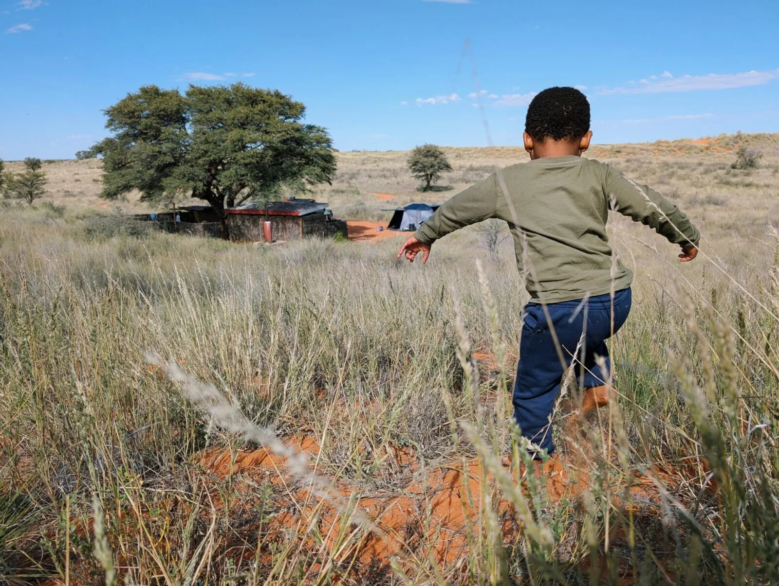 Child running through a field